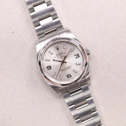 Rolex 114200 | 34 mm | 2012 | Cadran argent | Boite & Papiers | Acier