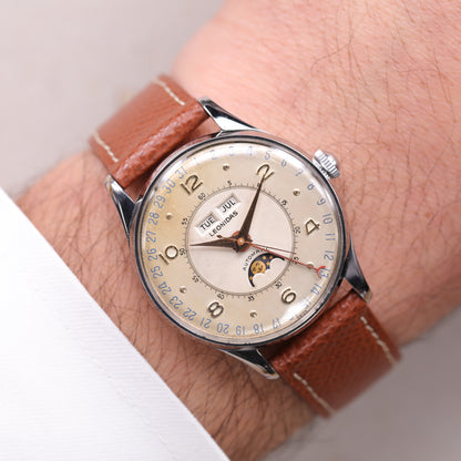 Leonidas Triple Date Moon Phase | 35 mm | CIRCA 1950 | Acier